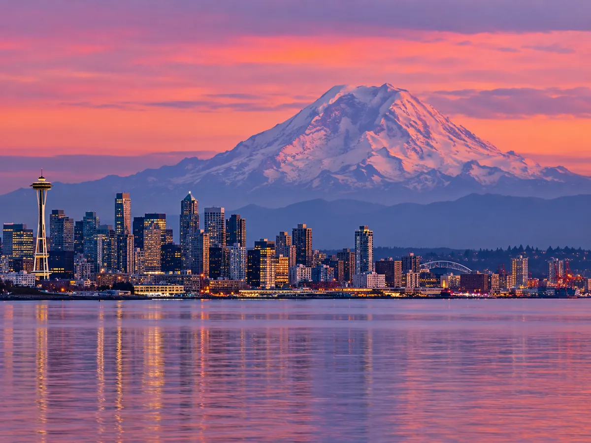 Seattle skyline at dusk with Mount Rainier looming on the horizon